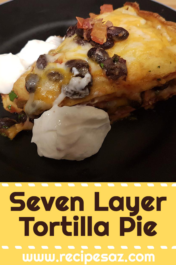 Seven Layer Tortilla Pie Recipe - This casserole is made from pinto and black beans layered with tortillas and cheese. #tortilla #tortillarecipe #tortillapie #tortillapierecipe #sevenlayertortilla #recipes #casserole #casserolerecipe #casserolerecipes #tortillacasserole